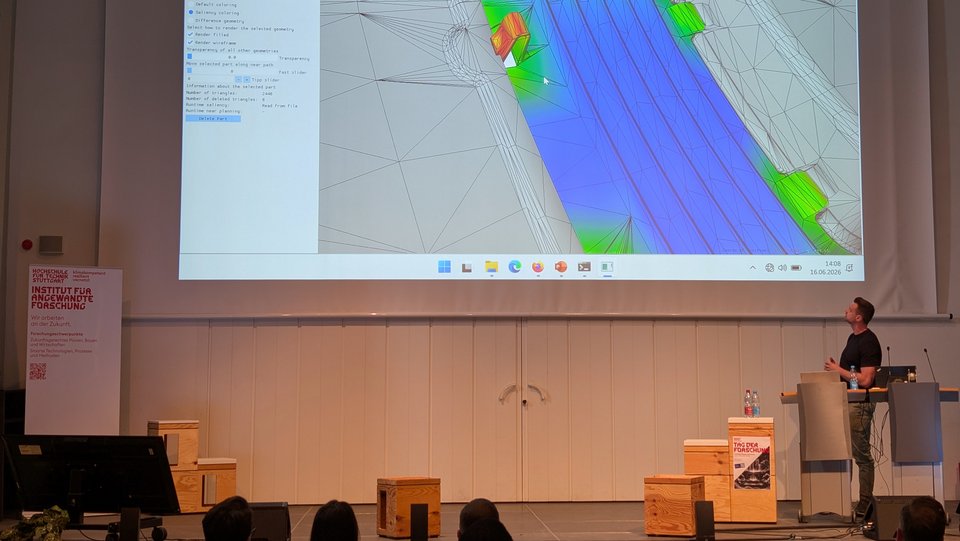 Tag der Forschung 2026 - Keynote "Digitale Montageplanung im Automobilbau", Prof. Dr. Nicola Wolpert und Kai Schleicher, Doktorand, HFT Stuttgart