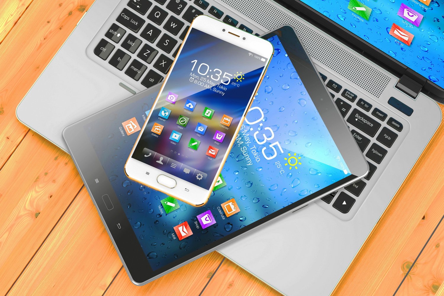 Laptop, Tablet und Mobiltelefon werden gezeigt